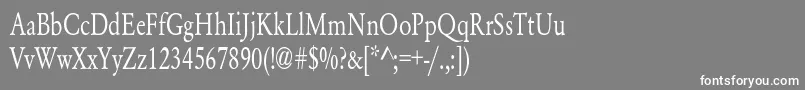 YearlindNormalCondensed-fontti – valkoiset fontit harmaalla taustalla