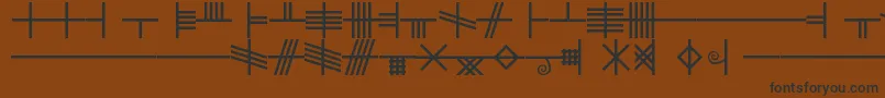 フォントBlf – 黒い文字が茶色の背景にあります