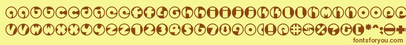 フォントSpslcirclestwoc – 茶色の文字が黄色の背景にあります。