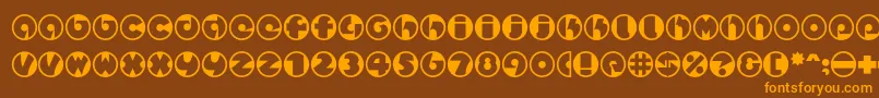 フォントSpslcirclestwoc – オレンジ色の文字が茶色の背景にあります。