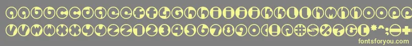 フォントSpslcirclestwoc – 黄色のフォント、灰色の背景