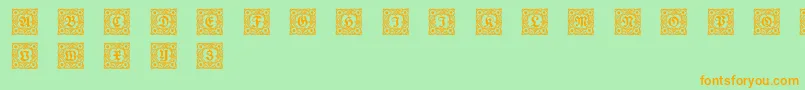 フォントSchmuckinitialen1 – オレンジの文字が緑の背景にあります。