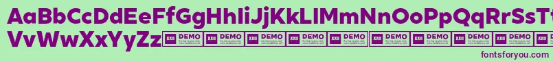 XxiigeomdemoHeavy-fontti – violetit fontit vihreällä taustalla