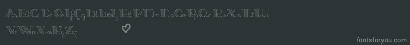 JackAndTheBeanstalkLine-fontti – harmaat kirjasimet mustalla taustalla