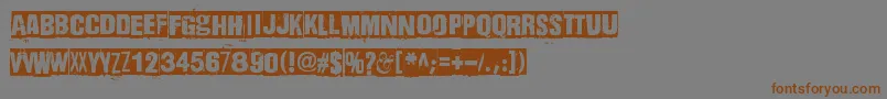 フォントDharmaPunk – 茶色の文字が灰色の背景にあります。