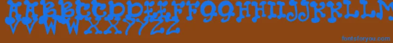 JmhPetsCaps Font – Blue Fonts on Brown Background