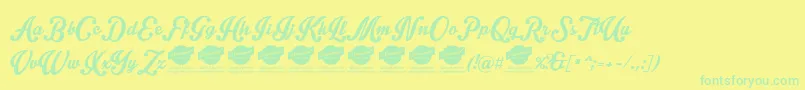 フォントIntriquescript – 黄色い背景に緑の文字