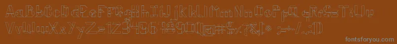 KubosOrigami-fontti – harmaat kirjasimet ruskealla taustalla