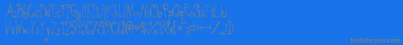 フォントGwquirtt – 青い背景に灰色の文字