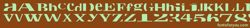 フォントCropfontxtra – 緑色の文字が茶色の背景にあります。