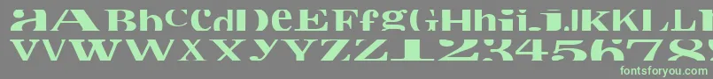 フォントCropfontxtra – 灰色の背景に緑のフォント