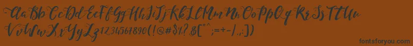 Weitere Informationen zur MonicaScript-Schriftart MonicaScript-Schriftart – Schwarze Schriften auf braunem Hintergrund
