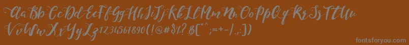 フォントMonicaScript – 茶色の背景に灰色の文字