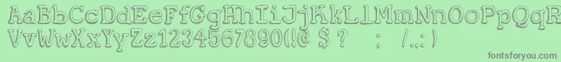 フォントDkKoerier – 緑の背景に灰色の文字