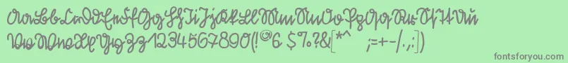 フォントKleinsfirstscript – 緑の背景に灰色の文字