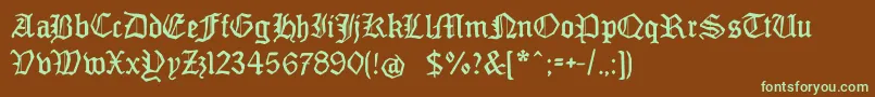 フォントMonamourfraktur2 – 緑色の文字が茶色の背景にあります。