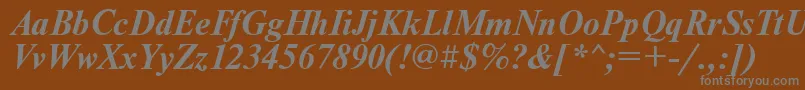 UkrainiantimesetBolditalic-fontti – harmaat kirjasimet ruskealla taustalla
