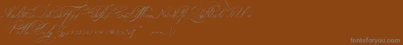 Шрифт IndentureenglishpenmanPersonalUseDemo – серые шрифты на коричневом фоне