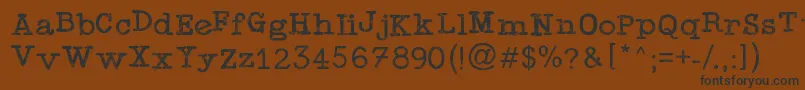 TypewriterPress Font – Black Fonts on Brown Background
