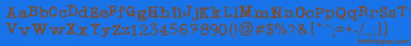 TypewriterPress-Schriftart – Braune Schriften auf blauem Hintergrund