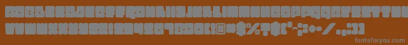 Czcionka Funkygraphy – szare czcionki na brązowym tle