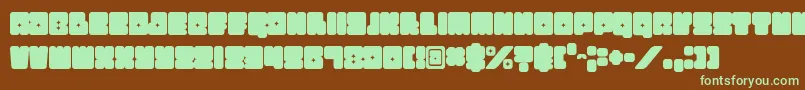 フォントFunkygraphy – 緑色の文字が茶色の背景にあります。