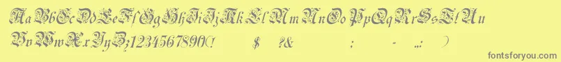 フォントUechiItalic – 黄色の背景に灰色の文字