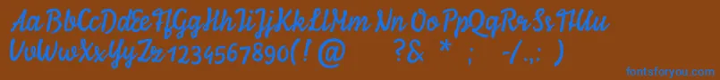 YlvieScript Font – Blue Fonts on Brown Background