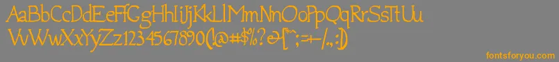 フォントJempol – オレンジの文字は灰色の背景にあります。