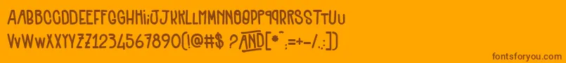 Quenelles-Schriftart – Braune Schriften auf orangefarbenem Hintergrund