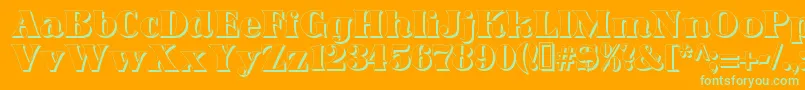 DominoShadow-Schriftart – Grüne Schriften auf orangefarbenem Hintergrund