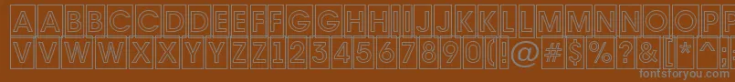 Avante7-fontti – harmaat kirjasimet ruskealla taustalla