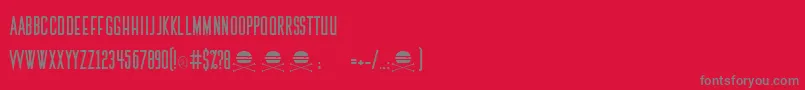 フォントThemedicRegular – 赤い背景に灰色の文字