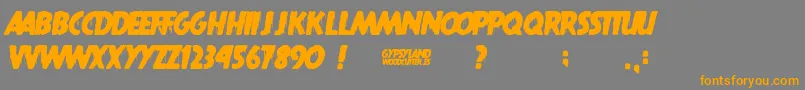 Gypsyland-Schriftart – Orangefarbene Schriften auf grauem Hintergrund