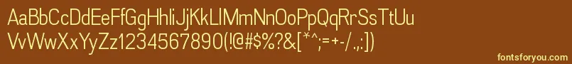 AkazanbkRegular-fontti – keltaiset fontit ruskealla taustalla