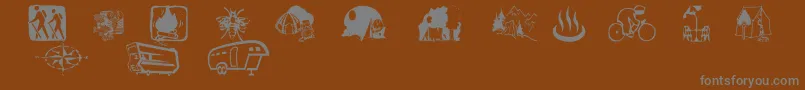 Aezcamping-Schriftart – Graue Schriften auf braunem Hintergrund