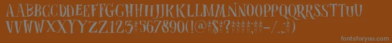 DkClosetSkeleton-fontti – harmaat kirjasimet ruskealla taustalla