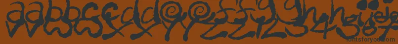 InkyScrawls Font – Black Fonts on Brown Background