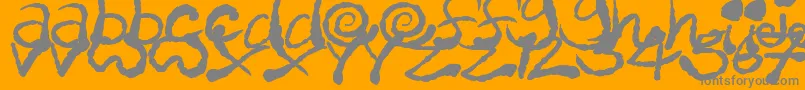 InkyScrawls-fontti – harmaat kirjasimet oranssilla taustalla