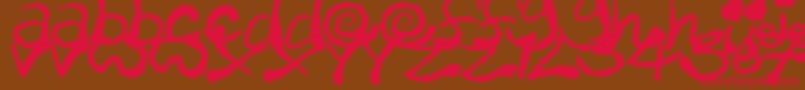 フォントInkyScrawls – 赤い文字が茶色の背景にあります。