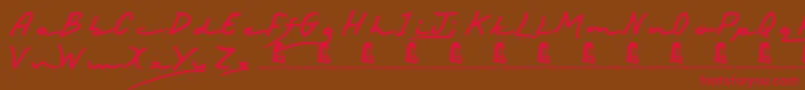 フォントHappyBirthday – 赤い文字が茶色の背景にあります。