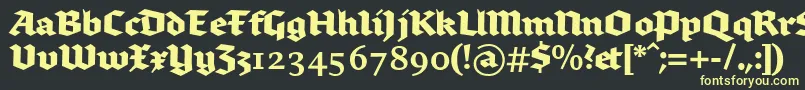 Czcionka Brokenscriptbold – żółte czcionki na czarnym tle