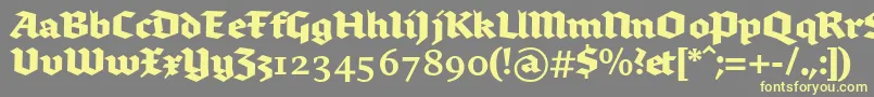 Brokenscriptbold-Schriftart – Gelbe Schriften auf grauem Hintergrund