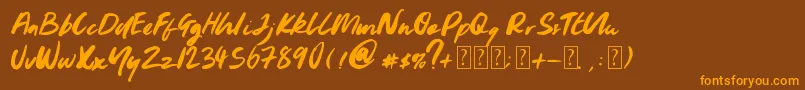 フォントYoungblood – オレンジ色の文字が茶色の背景にあります。