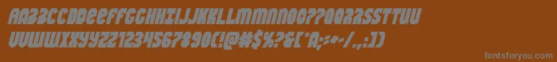 Warnationboldital-fontti – harmaat kirjasimet ruskealla taustalla