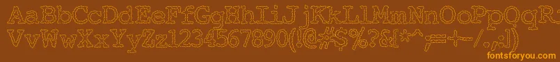 フォントElectricHermes – オレンジ色の文字が茶色の背景にあります。
