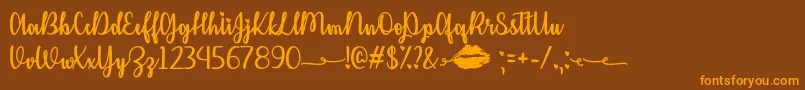 KissMeOrNotOtf Font – Orange Fonts on Brown Background