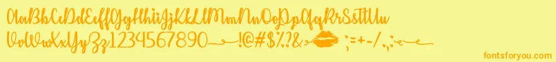 KissMeOrNotOtf Font – Orange Fonts on Yellow Background