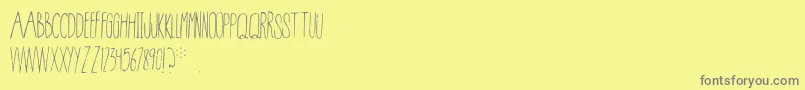Conspiracy Font – Gray Fonts on Yellow Background