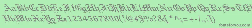 フォントOldEnglishLefty – 緑の背景に灰色の文字